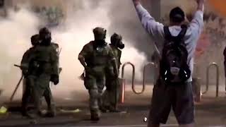 WARNING GRAPHIC CONTENT  US riot police use tear gas hit Portland protester with batons [upl. by Iroak]