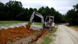 Trenching with the Mini Excavator [upl. by Dnalyk]